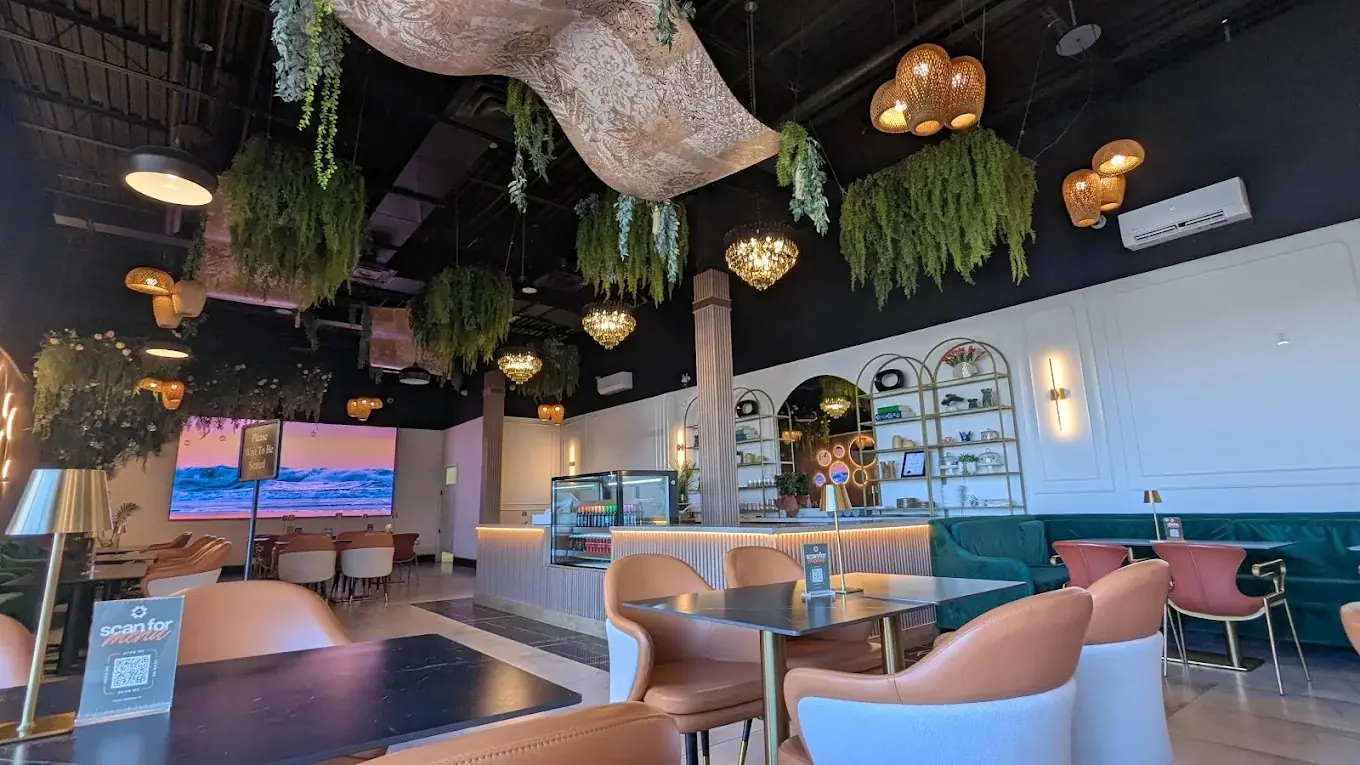 Armila's interior with TV screen and dining room